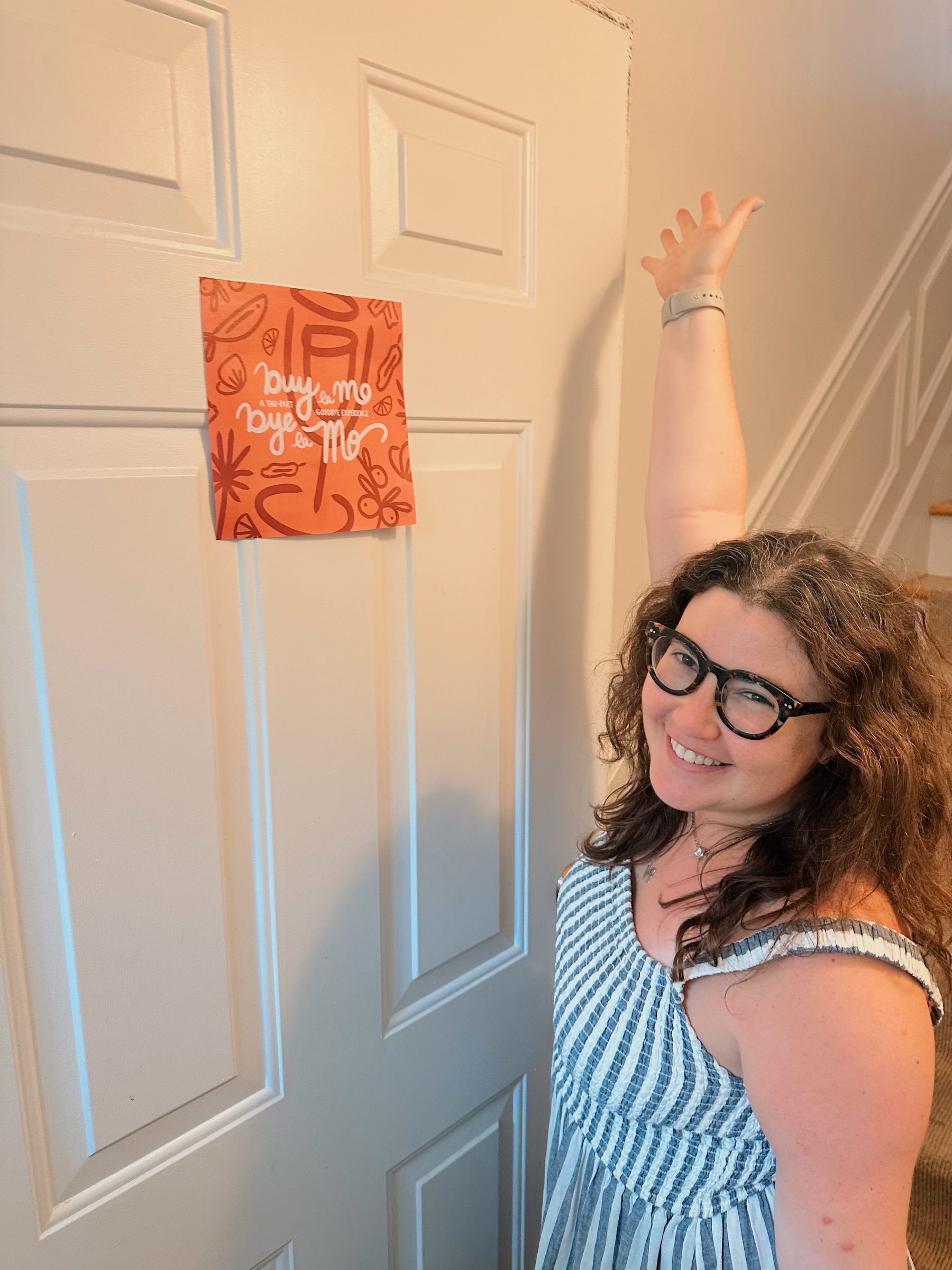 Ryan holding the Buy la Mo, Bye la Mo poster